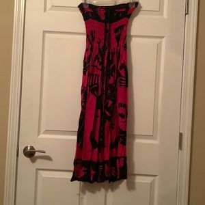 Sleeveless animal and symbol design dress.